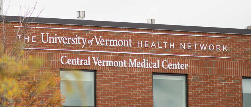 Exterior photo of UVM Health Network - CVMC sign on outside of CVMC hospital building