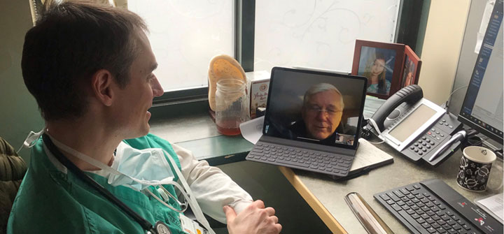 Dr. Jeremiah Eckhaus conducting video visit with patient