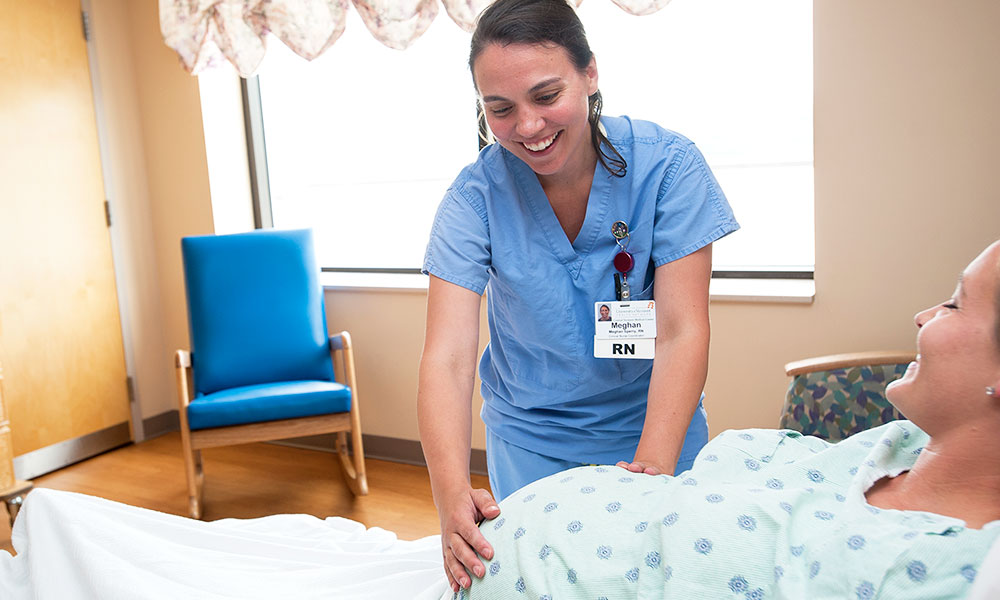 CVMC Registered Nurse checking in on soon to be mom Nurse checking on mom-to-be in birthing center.