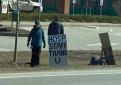 Two central Vermont community members outside of CVMC with sign thanking hospital workers