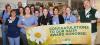 Group of CVMC nurses hold up Daisy Award banner